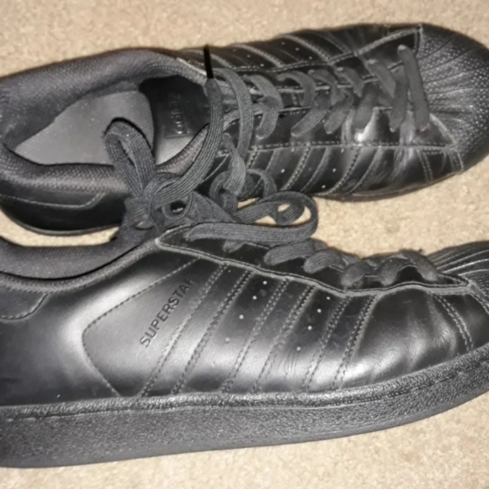 Men's leather tennis shoes by Adidas